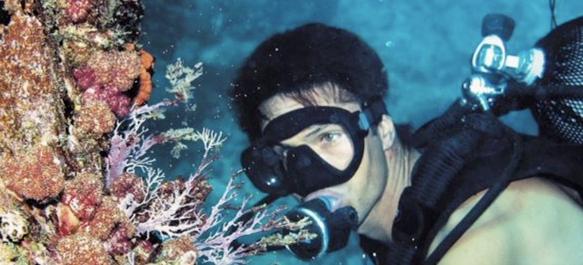 Diver over coral reef